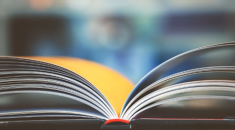 An open book sitting on top of a table.